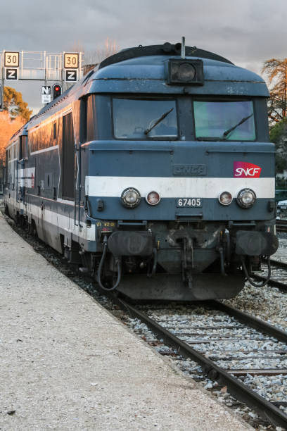 Picture of a passenger regional train from the French railway company, SNCF, in the Aix en provence Train station on the platforms. The SNCF Class BB 67400 diesel locomotives were built by Brissonneau and Lotz between 1969\