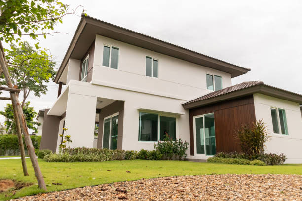 istock Beautiful modern house exterior with green grass 1336192133