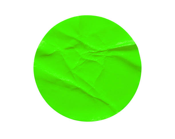 istock Green round paper sticker label isolated on white background 1336192417
