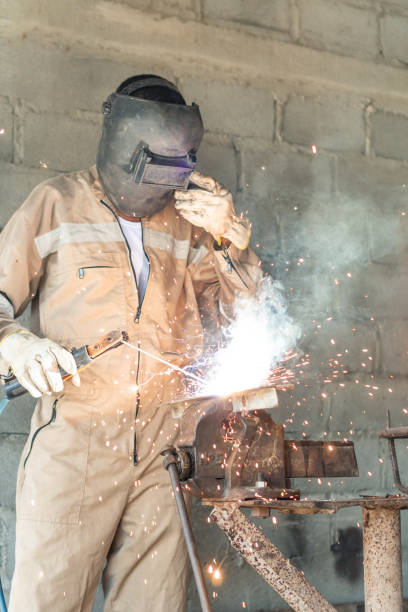 istock welder working in the garage factory 1336192670