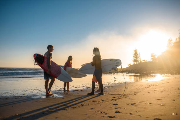 istock Burleigh Heads Surfers Talking on Beach at Sunrise 1336192728