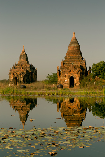 Lagoon reflections of ancient temples in Bagan, Myanmar.