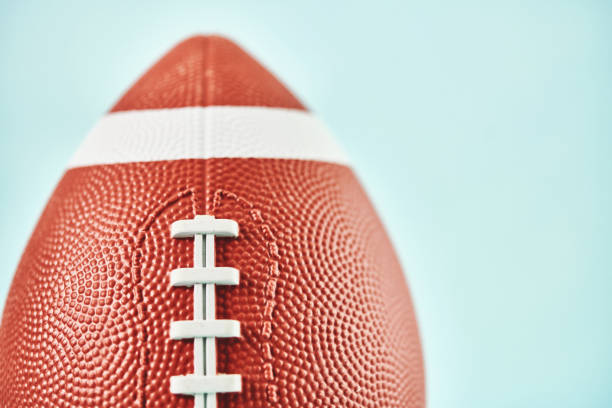 istock American football against blue background 1336211036