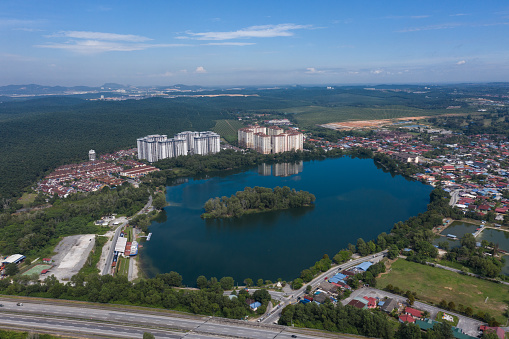 Arial view of rural town and residential with highway and lake