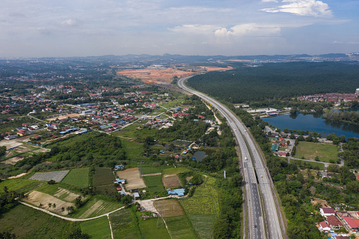 Arial view of rural town and residential with highway and lake