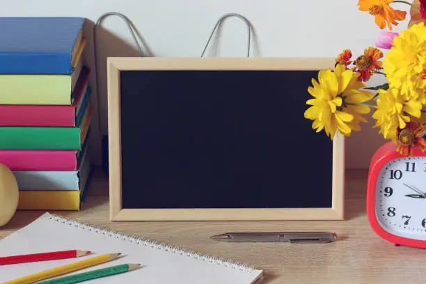 Photo of blackboard on the table school mockup back to school