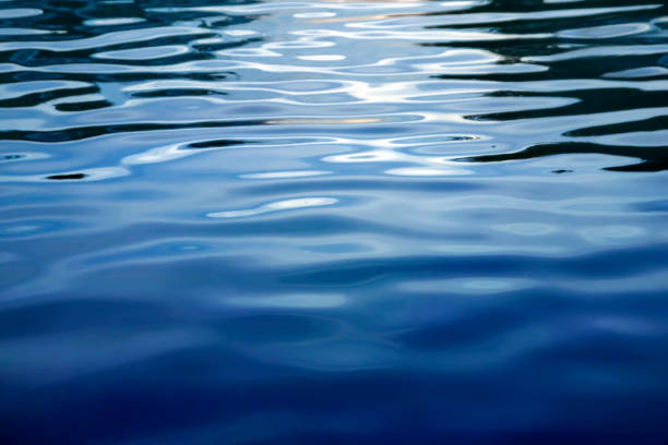 Blue rippled water  background Blue rippled water surface. Abstract blue water sea for background calm water photos stock pictures, royalty-free photos & images
