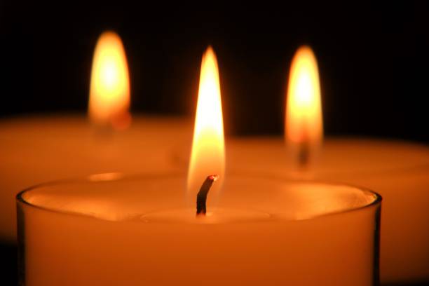 istock Candle flame. white candles Set. Burning candles in the dark 1336221337