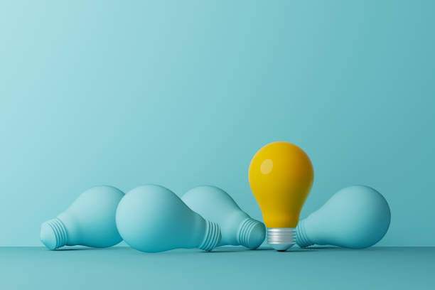 istock Light bulb yellow outstanding among lightbulb light blue on same color background. Concept of creative idea and innovation, Unique, Think different, Individual and standing out from the crowd. 3d illustration 1336223147