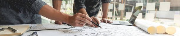 two male colleagues collaborating an architecture project about rooms