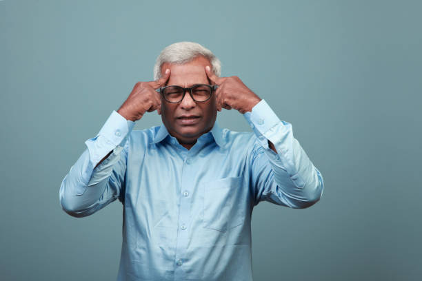 istock Elderly man of Indian origin feeling head ache 1336228962