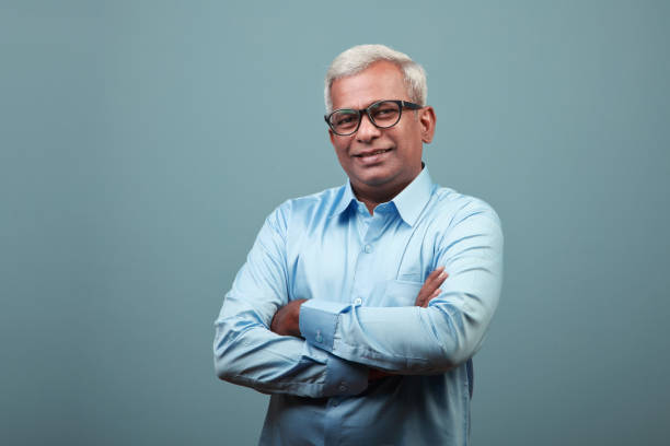 portrait of a happy mature man of indian ethnicity - businessman mature adult 50s men imagens e fotografias de stock
