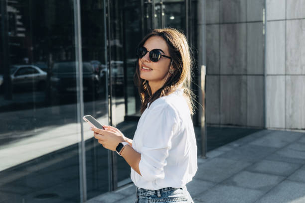 Portrait of a Successful Business woman Using iPhone 12 pro