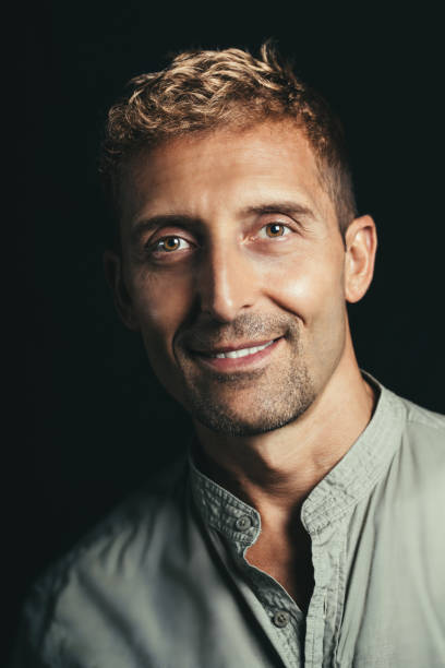 istock Smiling mature man portrait in studio. 1336232672