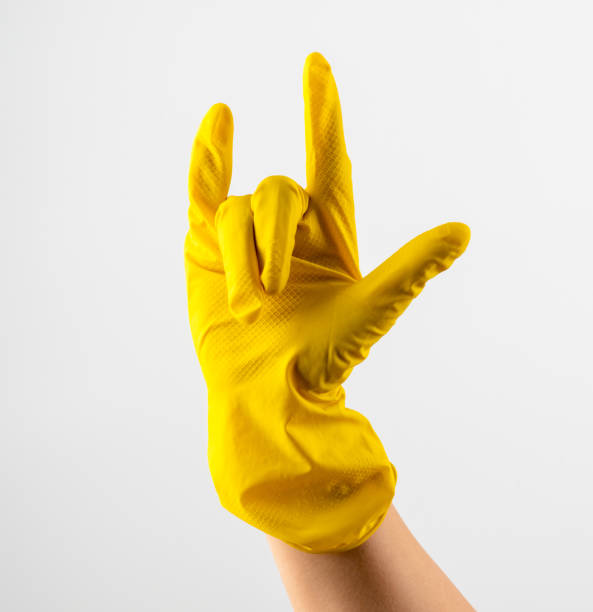 istock A hand in yellow rubber gloves shows a rock horn 1336234205