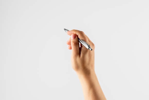 istock Hand holding pen writing on white background 1336234211