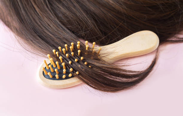 istock Shiny brown straight long hair with brush 1336237675