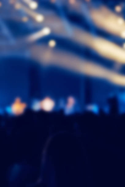 istock De-focused concert stage with laser lights and beams. 1336238504