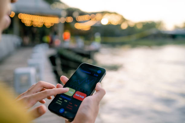 istock Young experts analyze financial charts on smartphones. 1336240092