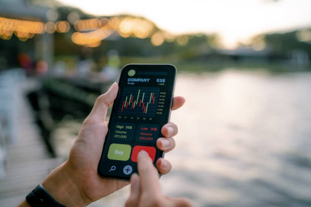 istock Young experts analyze financial charts on smartphones. 1336240096