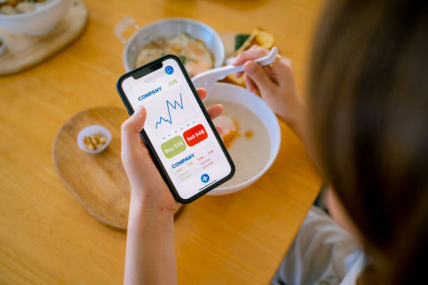 istock Young experts analyze financial charts on smartphones. 1336240113