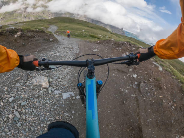 istock Mountain bikers on trail, POV 1336240530