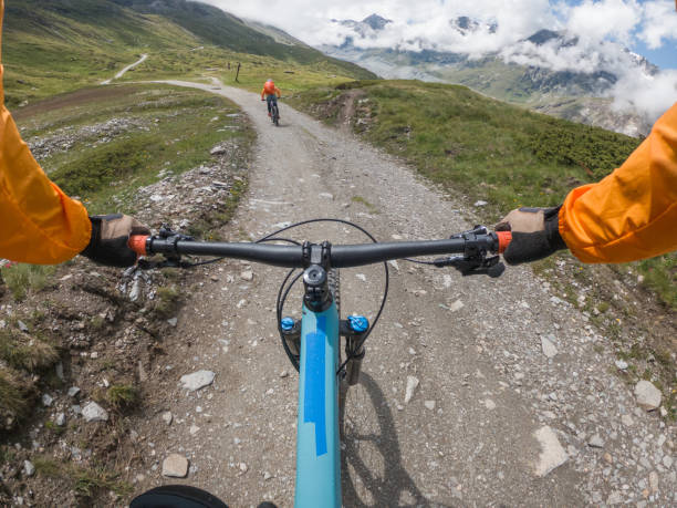 istock Mountain bikers on trail, POV 1336240634