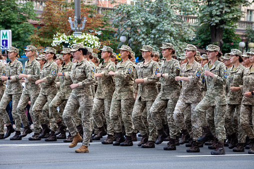Ukraine, Kyiv - August 18, 2021: Military women and girls in uniform. Ukrainian military march in the parade. Army infantry. Combat step. Girl soldier and officer