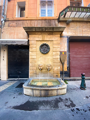 Fontaine des Bagniers, a fountain in the center of Aix en Provence with a medallion portrait of Paul Cézanne in bronze, drawn by Auguste Renoir