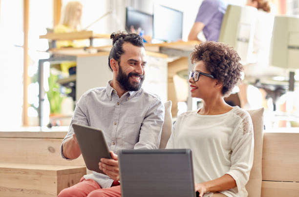 istock creative team with laptop and tablet pc in office 1336242952