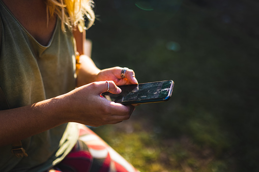 Hiker`s hands searching global positioning system