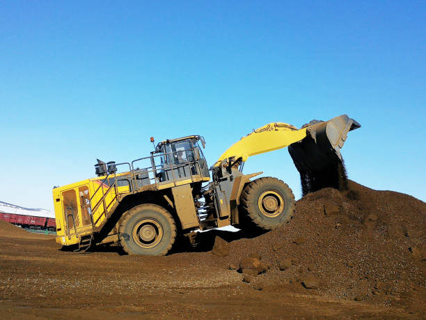 istock Heavy mechanical excavator operates on the construction site 1336243966