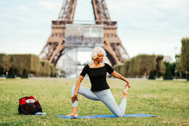 istock Mature woman stretching on morning training 1336244089