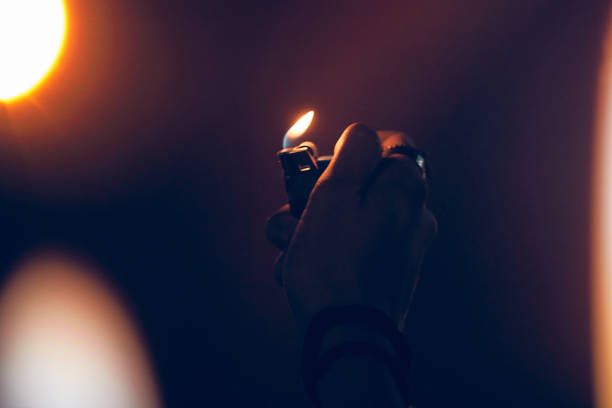 istock Person holding lighter on a concert. 1336244162