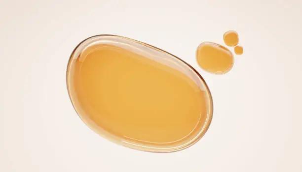 Photo of Gold stains of oil, serum droplets or honey on beige background. Bubbles collagen essence, realistic mockup liquid yellow drops cosmetic or food oil, top view on clear golden puddles water, 3d render