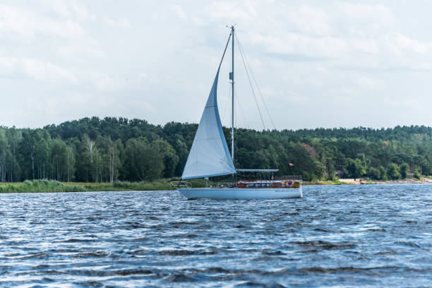 istock Sailboat Sailing on a River in Latvia 1336247061