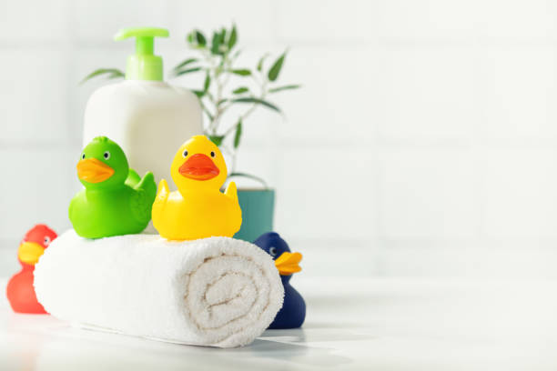 istock Bathroom accessories on white bathroom countertop against tile wall 1336247626