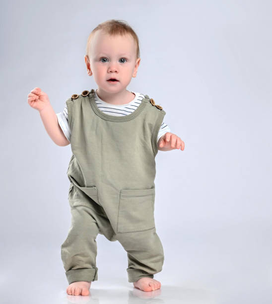 istock First steps of baby isolated on white background 1336248313