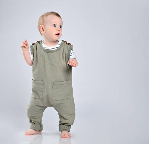 istock First steps of baby isolated on white background 1336248364