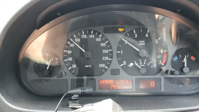 Car driving on road with engine problem