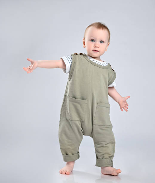 istock First steps of baby isolated on white background 1336248467