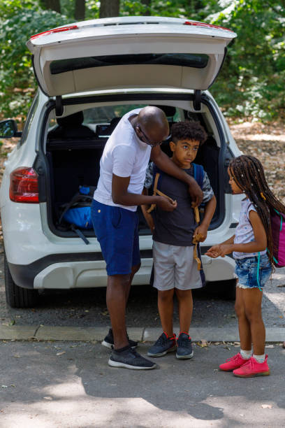 istock Father And Children Getting Ready For Hiking From Car 1336249848