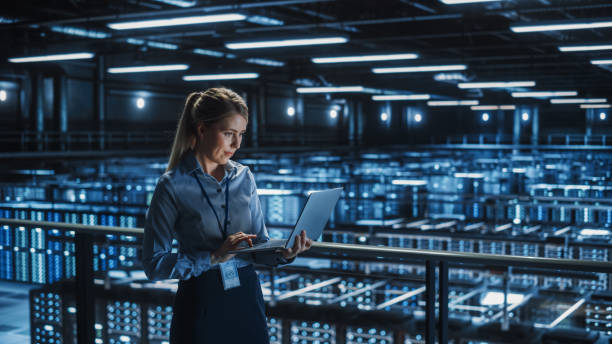 Data Center Female It Specialist Using Laptop. Server Farm Cloud Computing and Cyber Security Maintenance Administrator Working on Computer. Information Technology Professional. Data Center Female It Specialist Using Laptop. Server Farm Cloud Computing and Cyber Security Maintenance Administrator Working on Computer. Information Technology Professional. image technique stock pictures, royalty-free photos & images