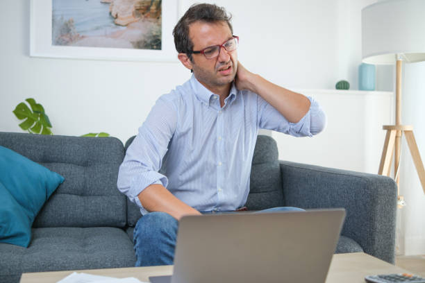 istock Pain from working from home with bad ergonomic posture 1336252088