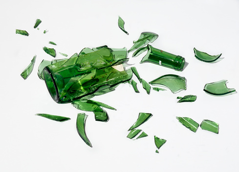 Broken green bottle of wine.
