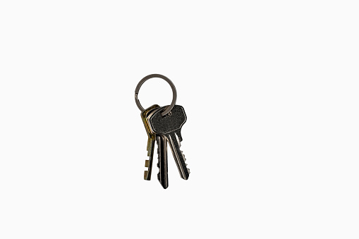 Directly above photo, bunch of keys, three keys in a bunch isolated on white background