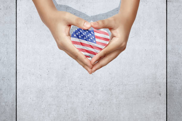 istock Human hand with an American flag in a heart shape 1336253622