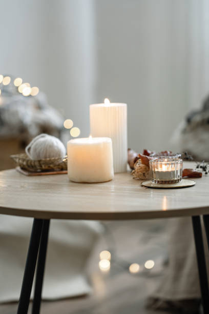 istock Cozy home composition with candles on blurred bokeh background. 1336256229