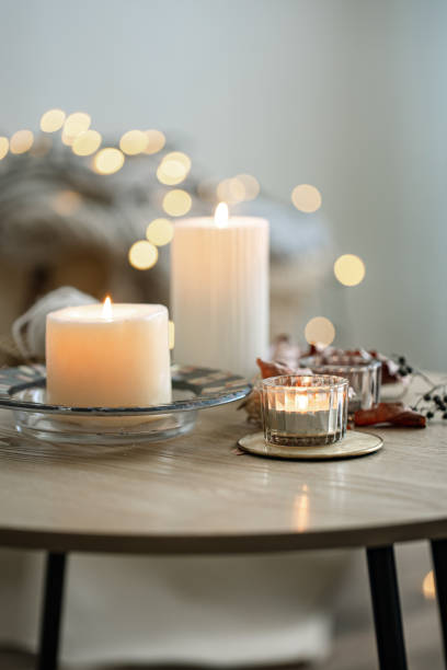 istock Cozy home composition with candles on blurred bokeh background. 1336256238