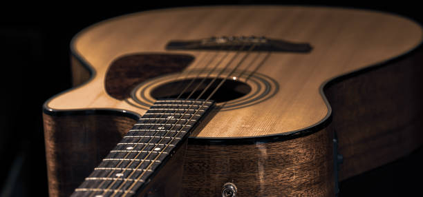 istock Close-up of a classical acoustic guitar on a black background. 1336256336